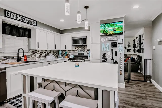 a kitchen with a table and chairs