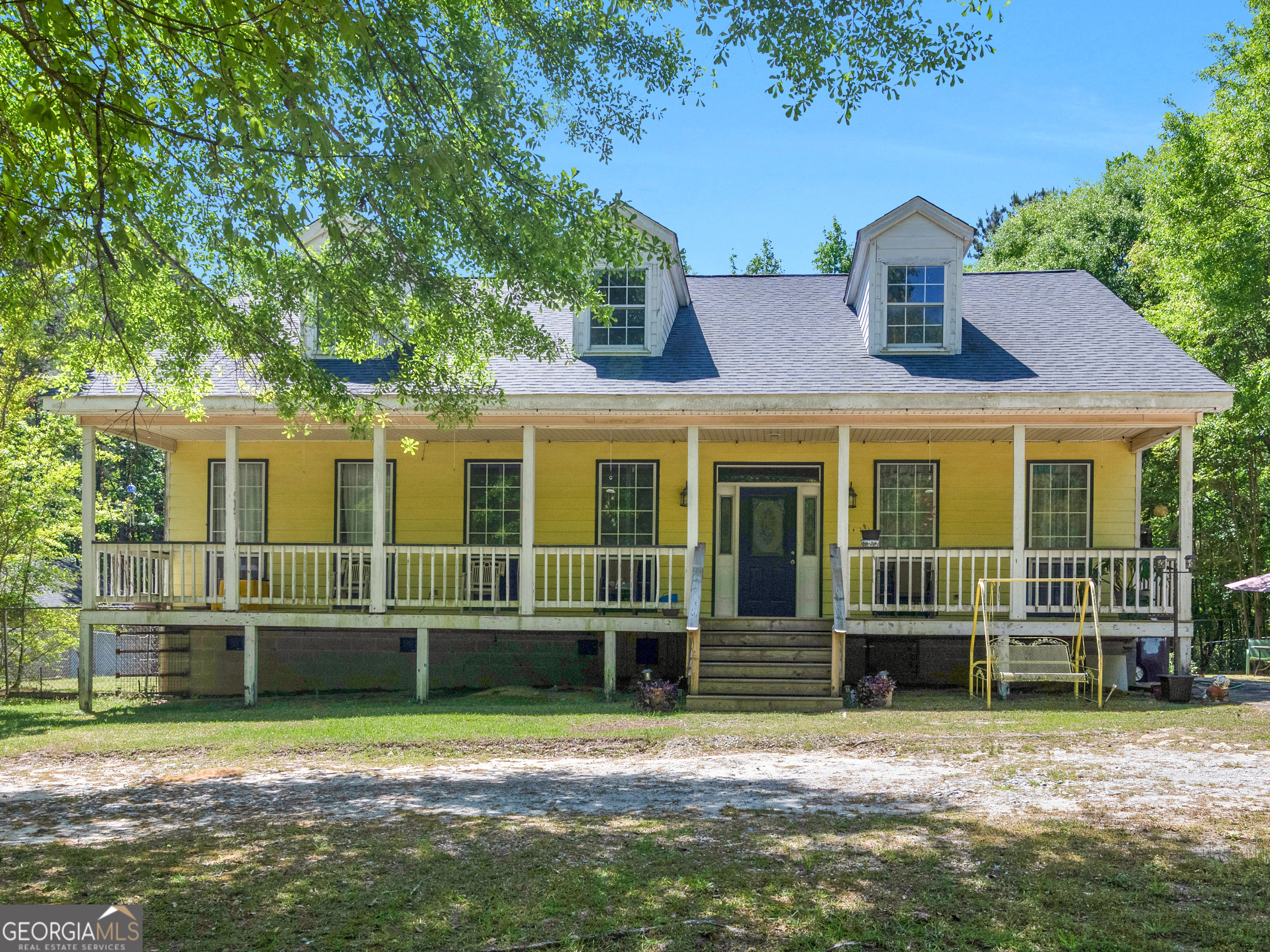 127 Little Road Hampton, GA 30228 - Photo 2 of 13 a front view of a house with a yard