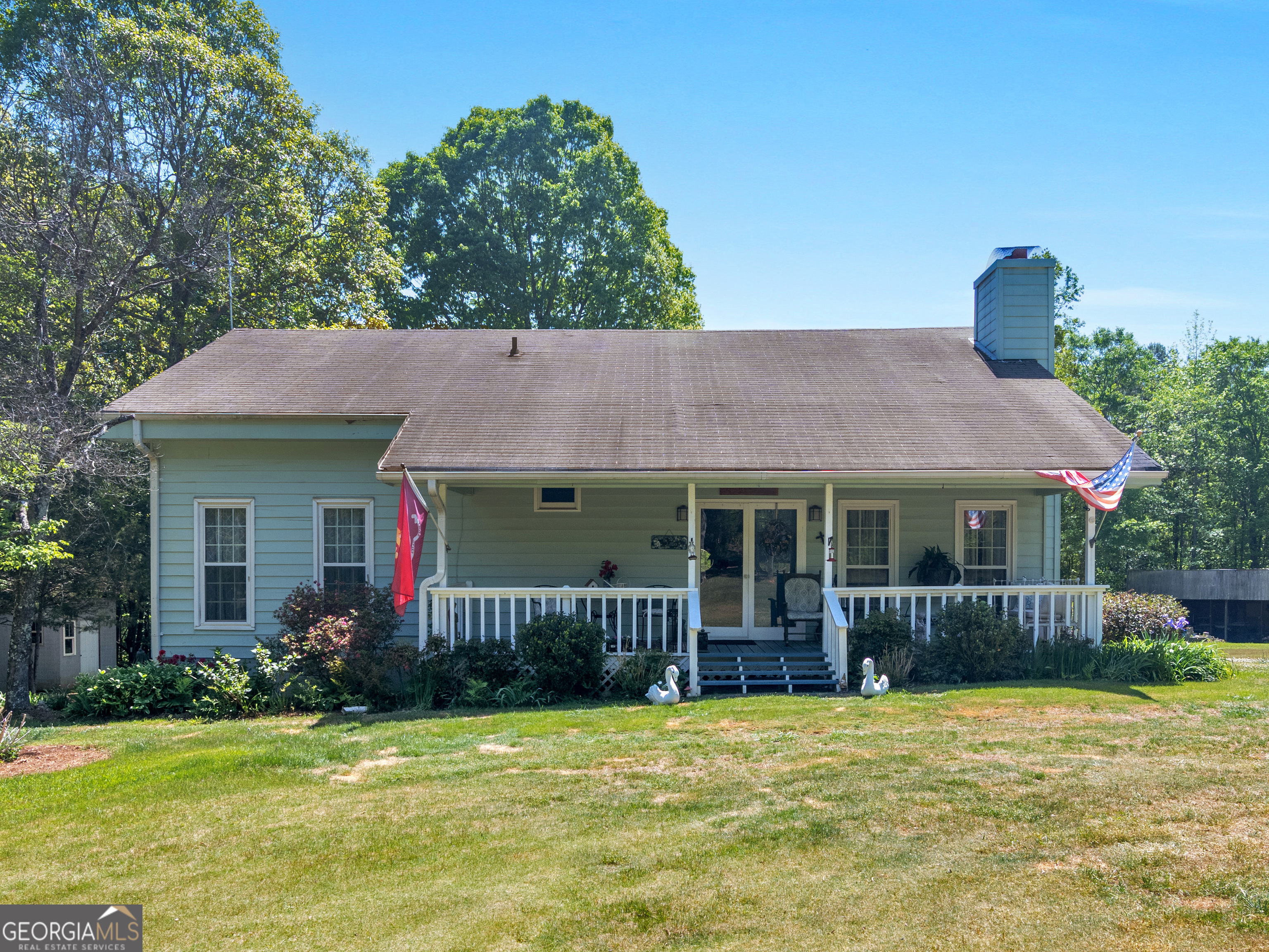 127 Little Road Hampton, GA 30228 - Photo 4 of 13 a front view of a house with garden