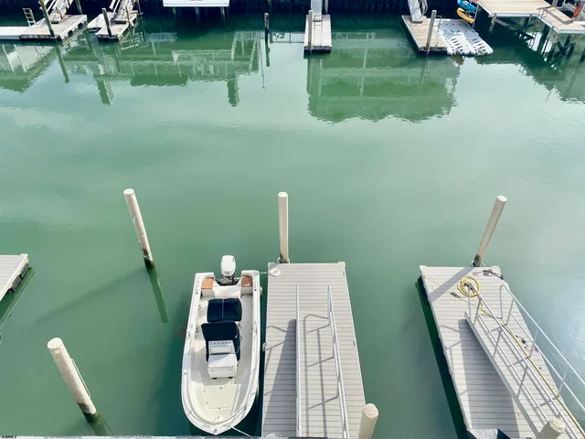 a living room with furniture and a lamp