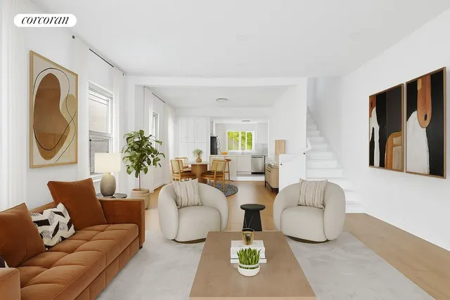 a living room with furniture a couch and wall painting