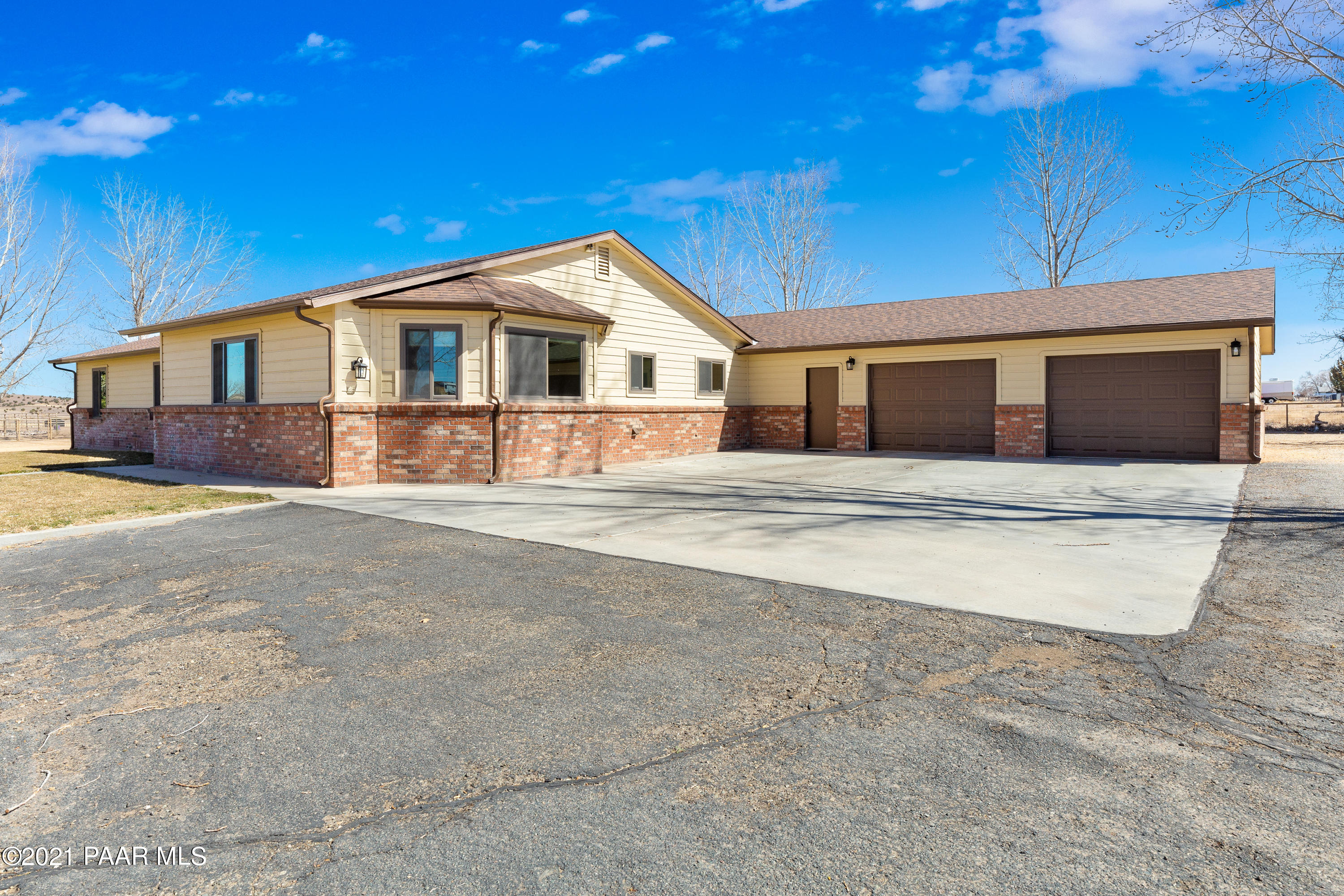 3727 North Reed Road Chino Valley, AZ 86323 - Photo 1 of 45 a front view of a house with a yard