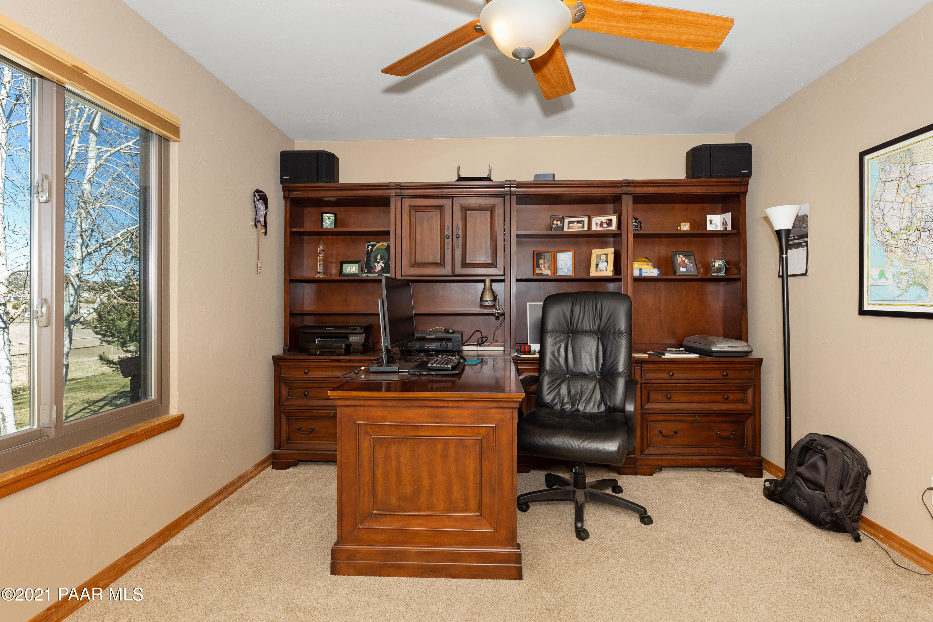 3727 North Reed Road Chino Valley, AZ 86323 - Photo 17 of 45 a view of a workspace with furniture and a window