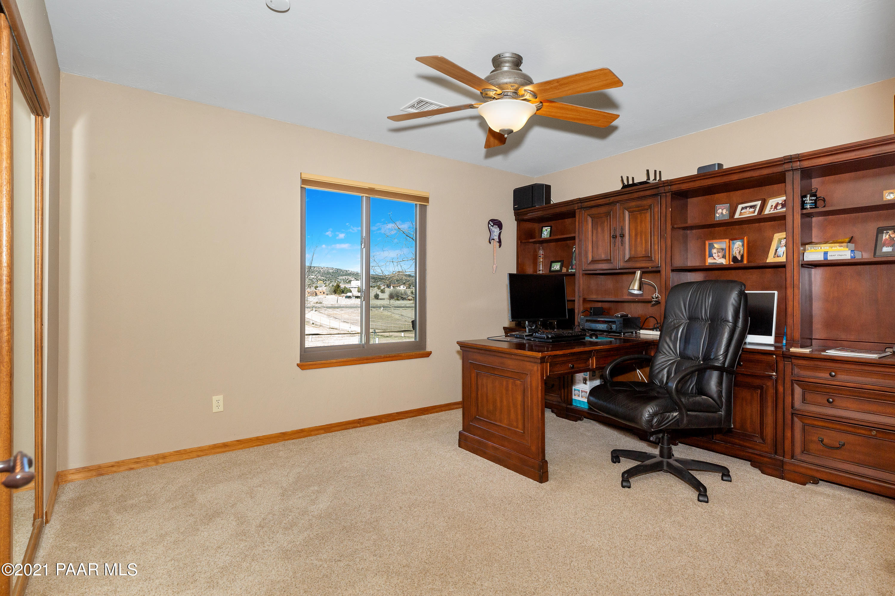 3727 North Reed Road Chino Valley, AZ 86323 - Photo 18 of 45 a view of a workspace with furniture and a window