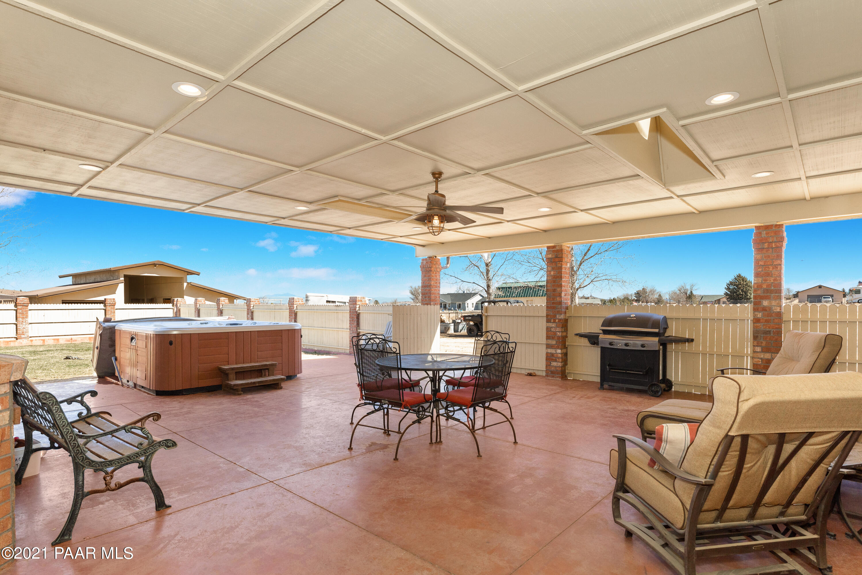3727 North Reed Road Chino Valley, AZ 86323 - Photo 21 of 45 a living room with furniture a fireplace and a table