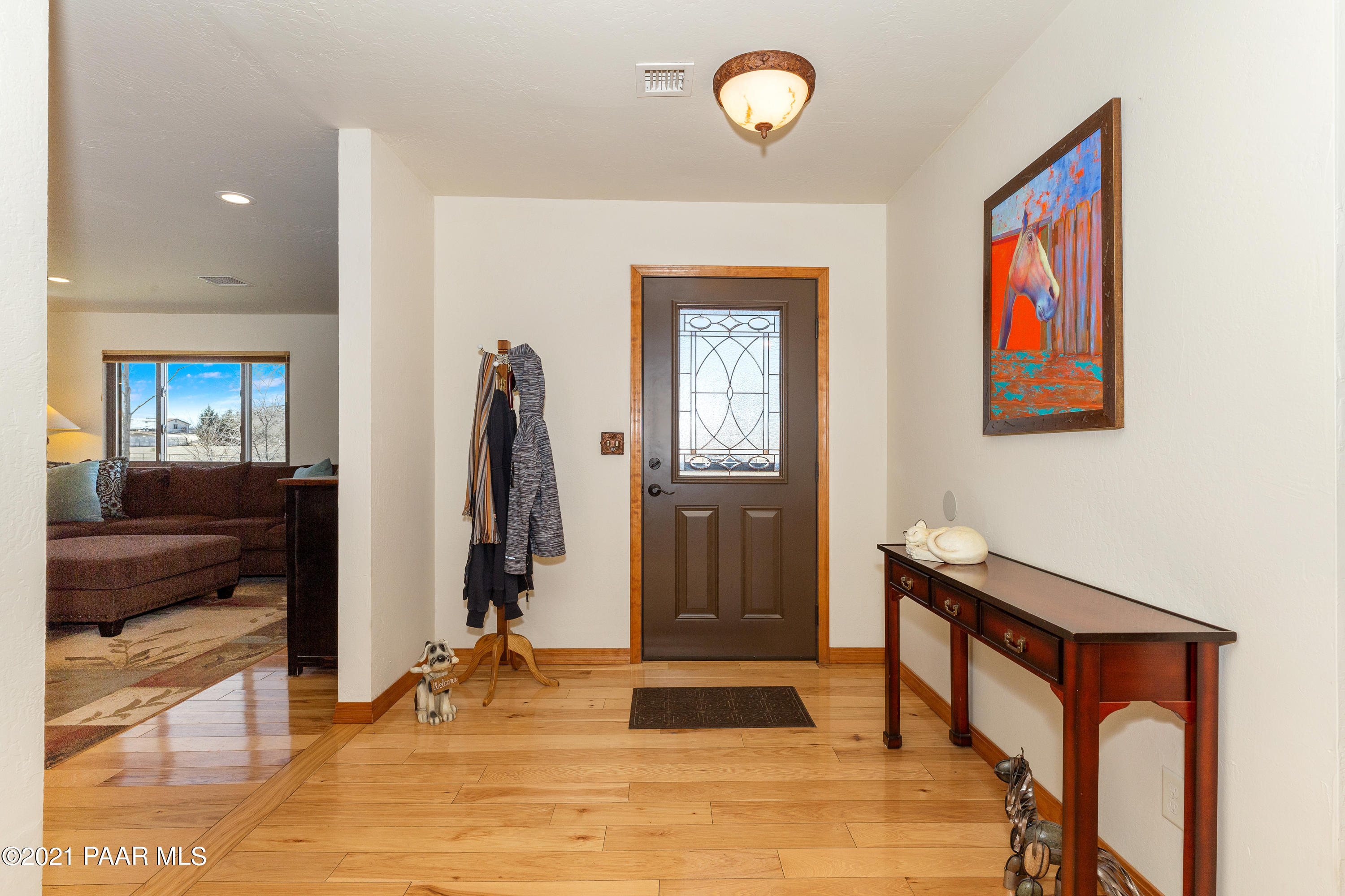 3727 North Reed Road Chino Valley, AZ 86323 - Photo 3 of 45 a view of a hallway with wooden floor and workspace
