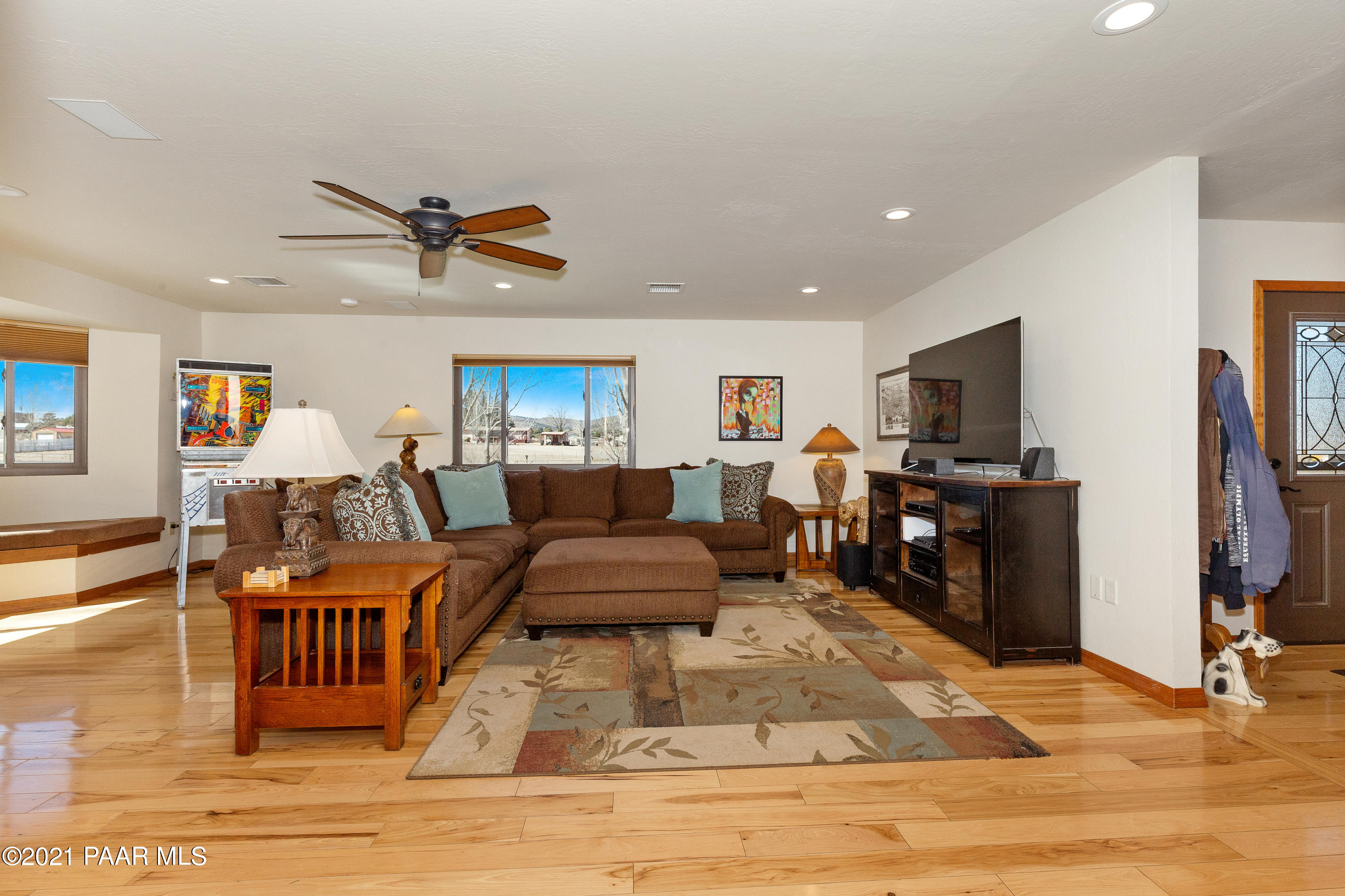 3727 North Reed Road Chino Valley, AZ 86323 - Photo 9 of 45 a living room with furniture and a flat screen tv