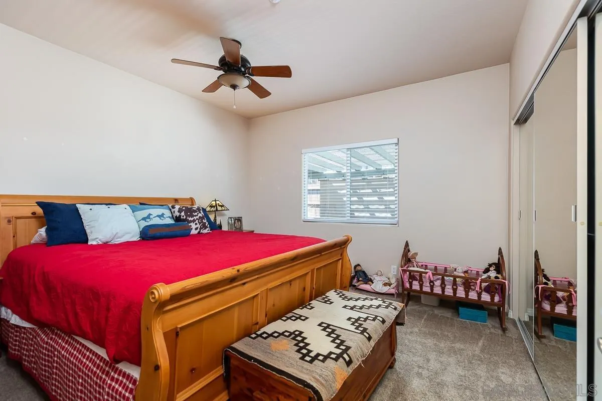 8538 Paseo De Los Castillos Santee, CA 92071 - Photo 12 of 20 a bedroom with a bed and a table