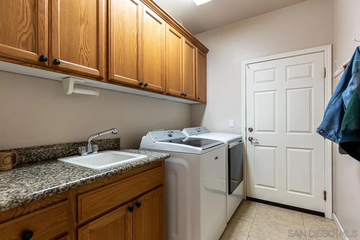 8538 Paseo De Los Castillos Santee, CA 92071 - Photo 17 of 20 a utility room with sink dryer and washer