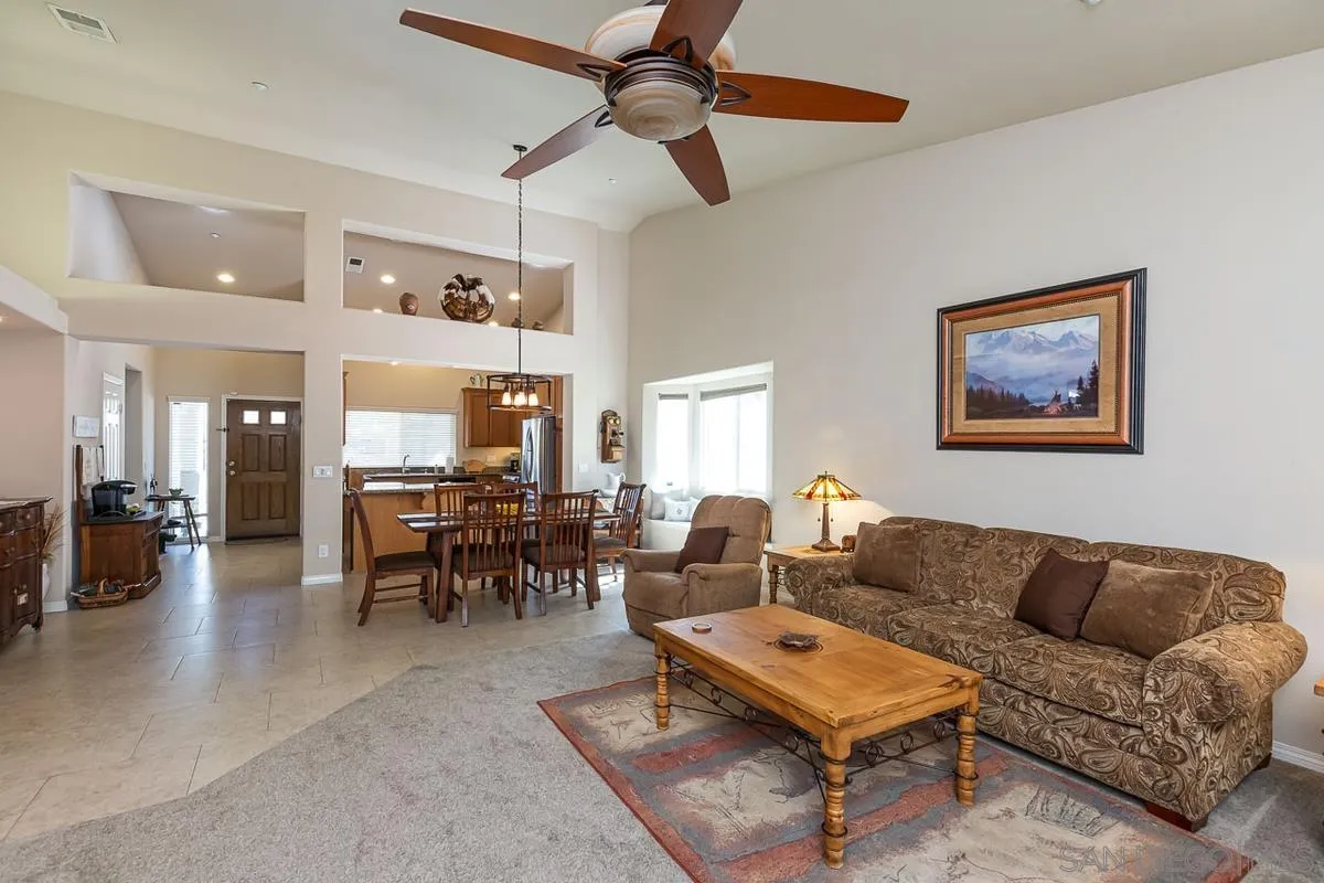 8538 Paseo De Los Castillos Santee, CA 92071 - Photo 2 of 20 a living room with furniture a dining table and chairs