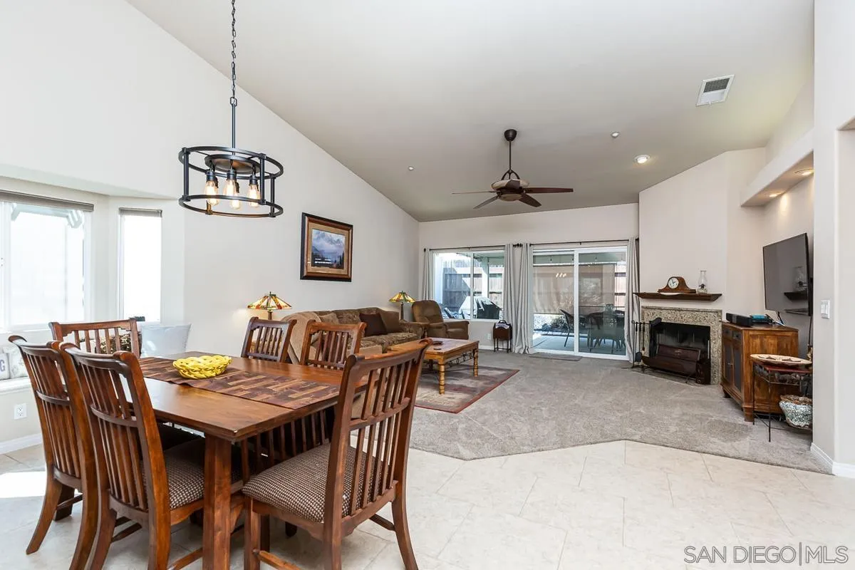 8538 Paseo De Los Castillos Santee, CA 92071 - Photo 3 of 20 a view of a dining room with furniture window and wooden floor