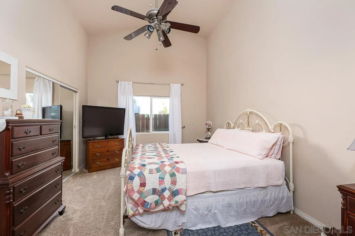 8538 Paseo De Los Castillos Santee, CA 92071 - Photo 9 of 20 a bedroom with a bed and flat screen tv