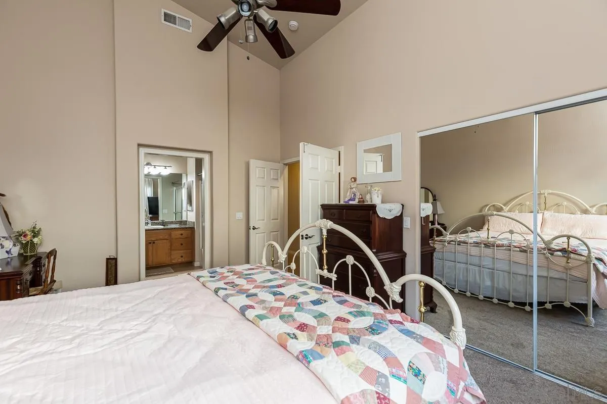 8538 Paseo De Los Castillos Santee, CA 92071 - Photo 10 of 20 a bedroom with bed and a flat tv screen