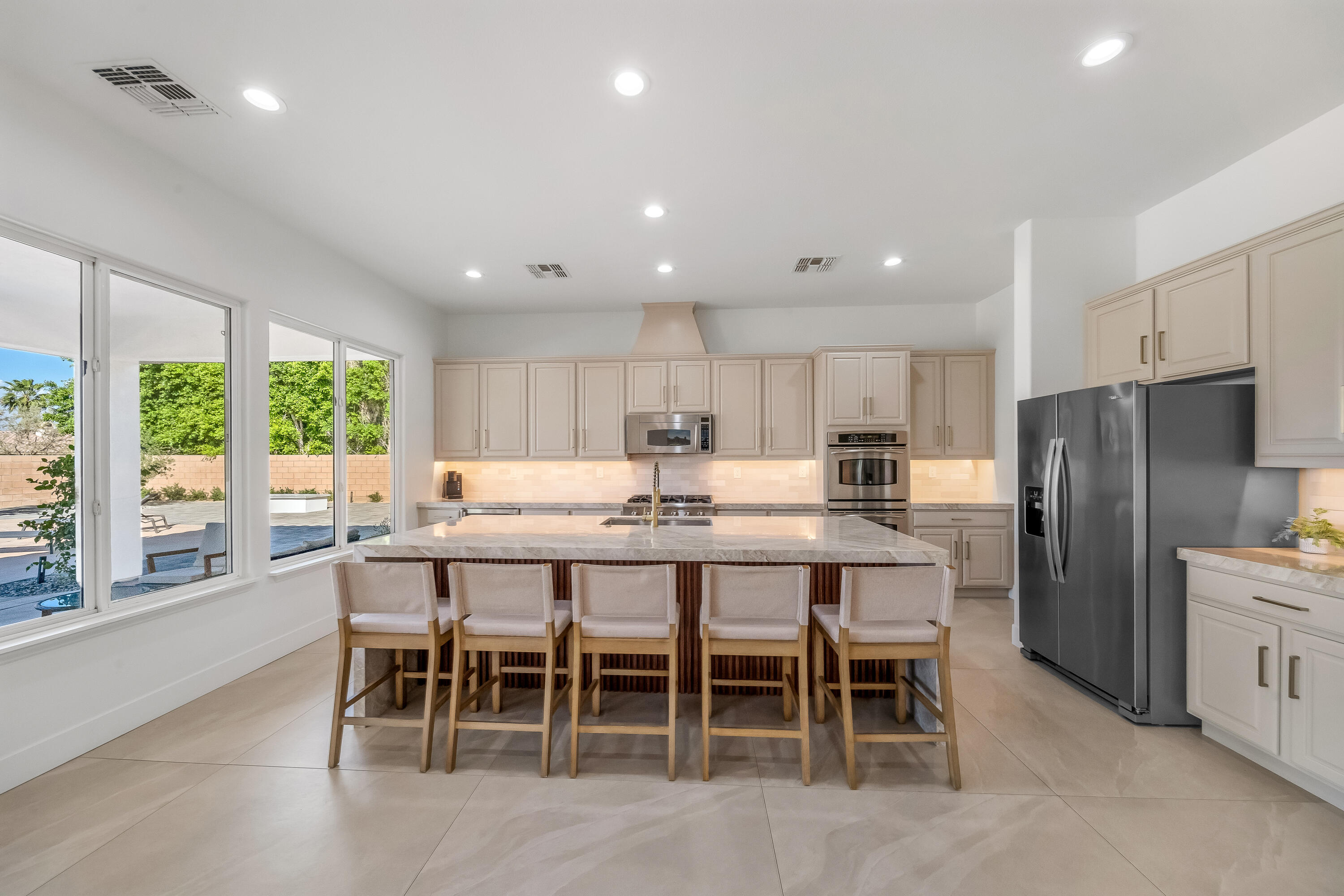 80262 Amazon Avenue Indio, CA 92201 - Photo 15 of 69 a large kitchen with a table and chairs