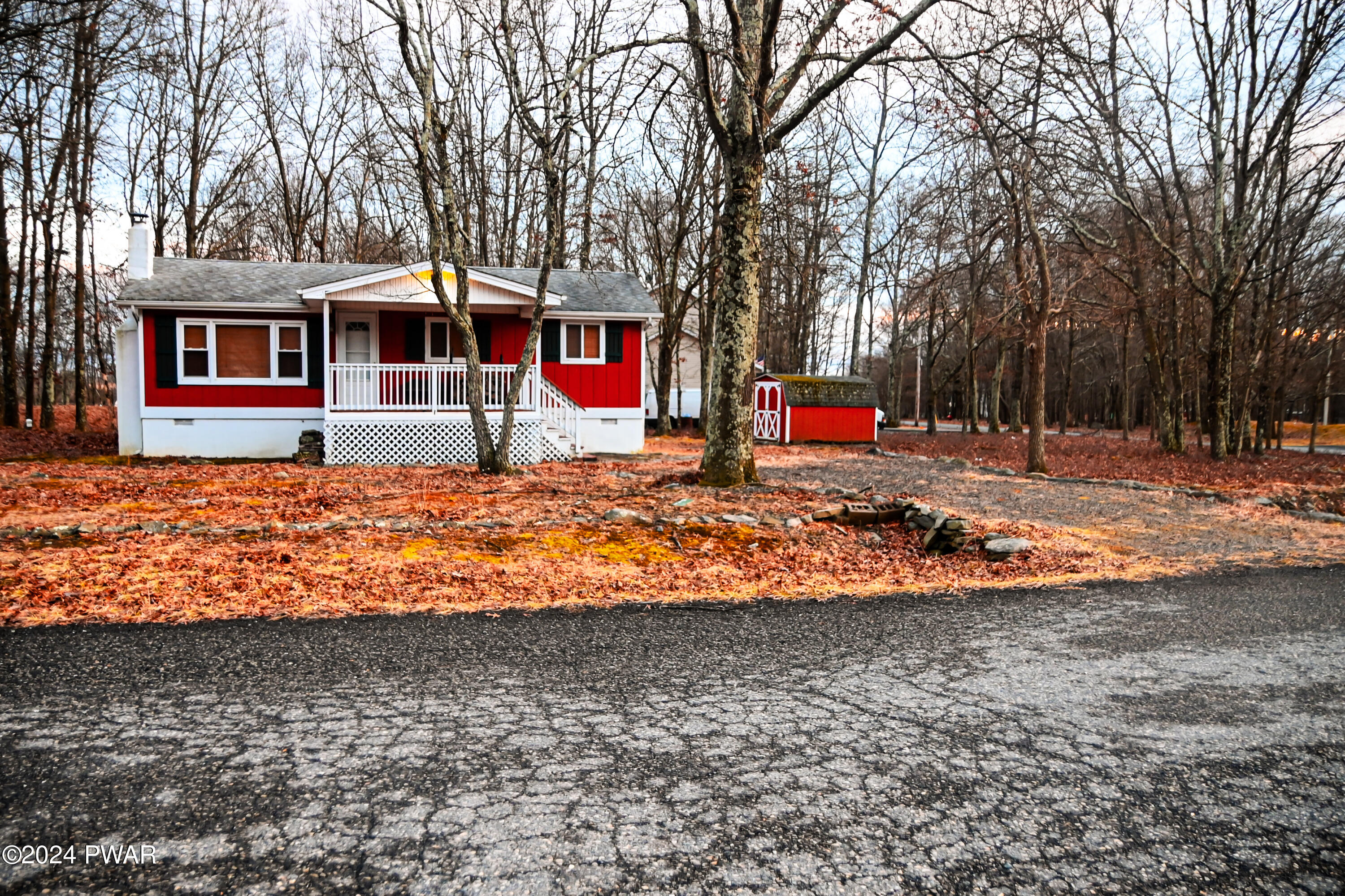 119 Pike Road Bushkill, PA 18324 - Photo 14 of 16 a view of street with large trees