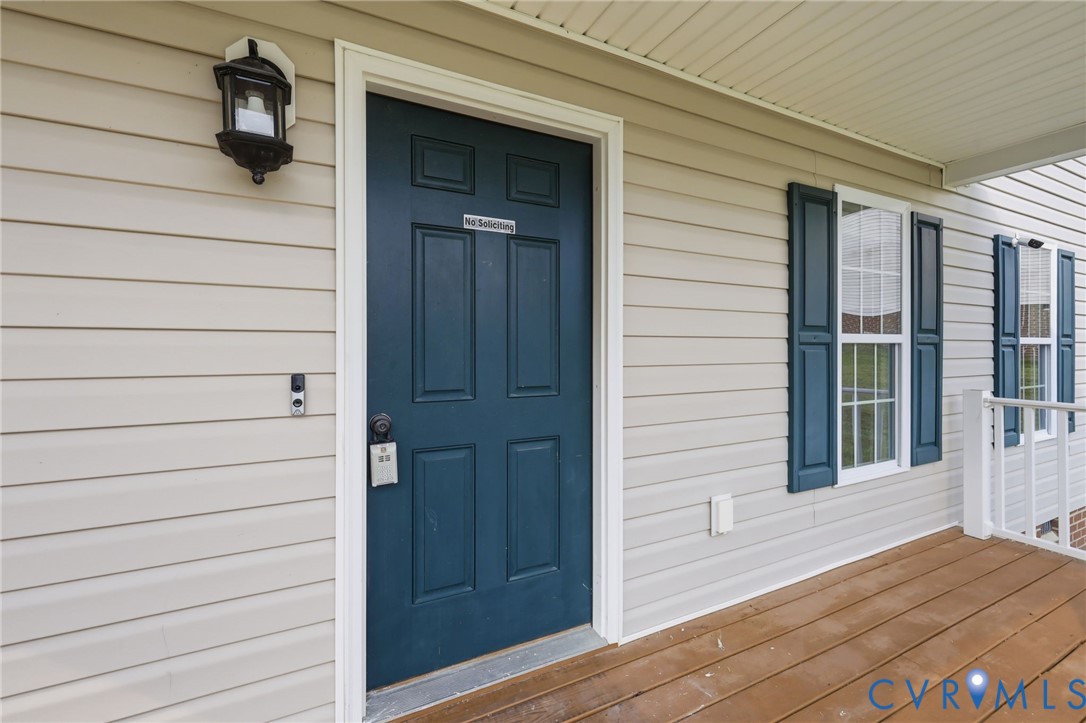 7610 Sugar Run Road Hopewell, VA 23860 - Photo 44 of 48 Front porch entrance featuring a paneled door, hor