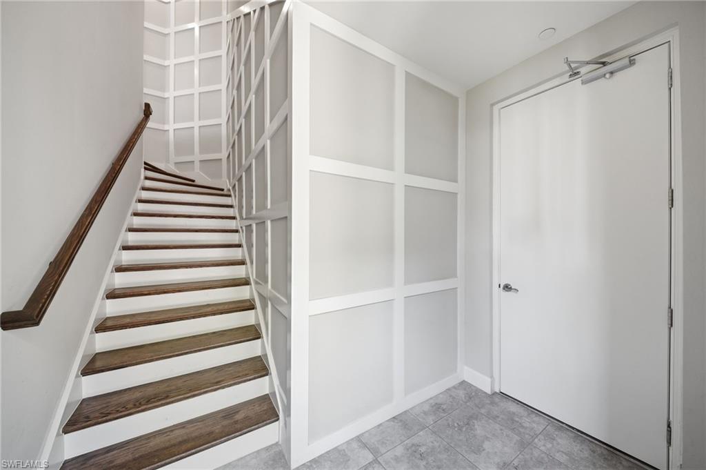 9658 Montelanico Loop, Unit 201 Naples, FL 34119 - Photo 26 of 46 a view of entryway with stairs