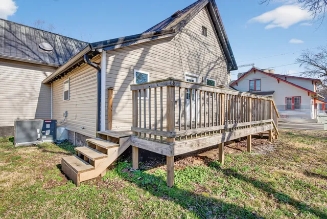 a view of a house with a yard patio and a yard