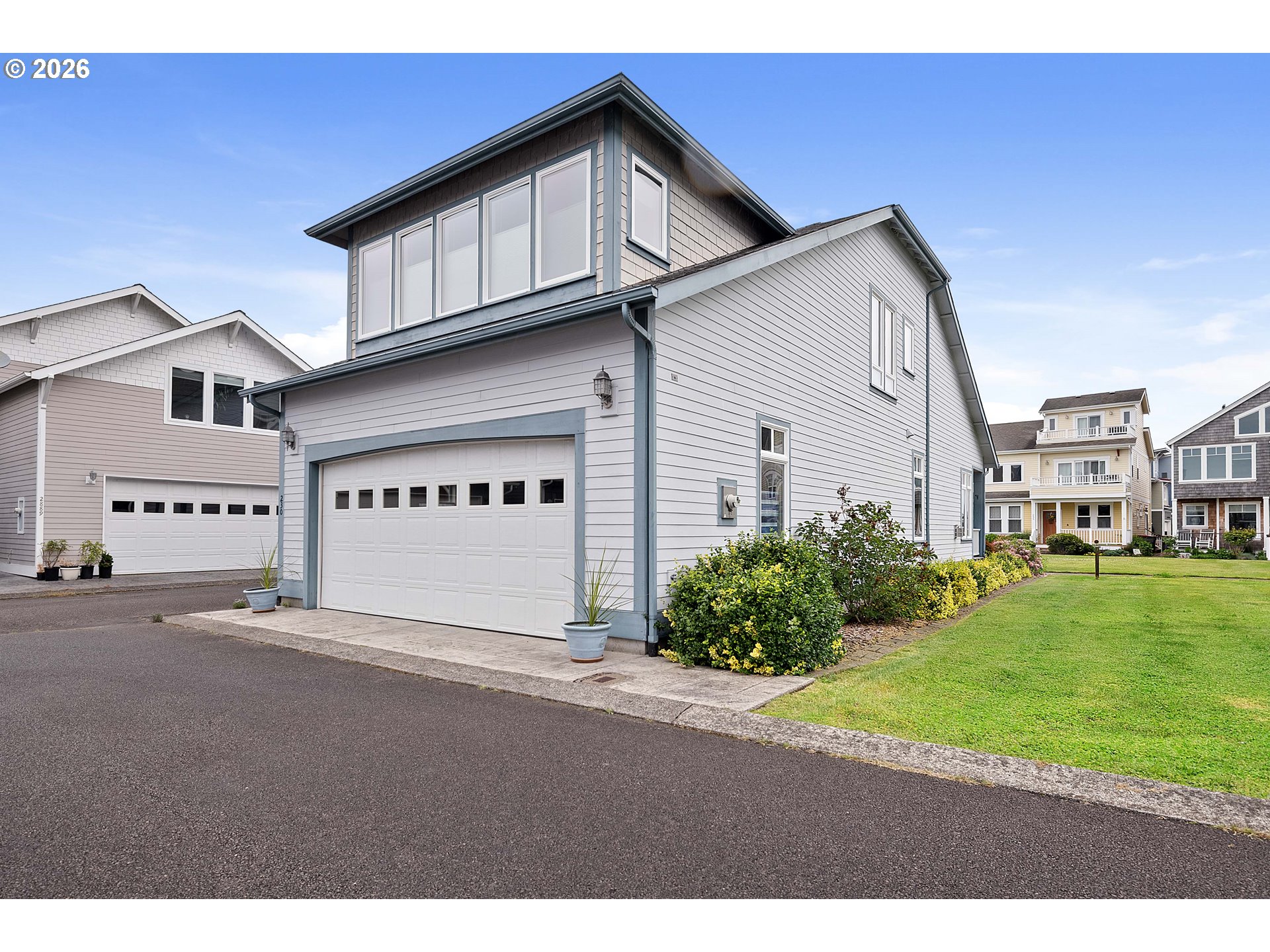 230 Round House Road Astoria, OR 97103 - Photo 37 of 43 a view of a house with a yard and garage