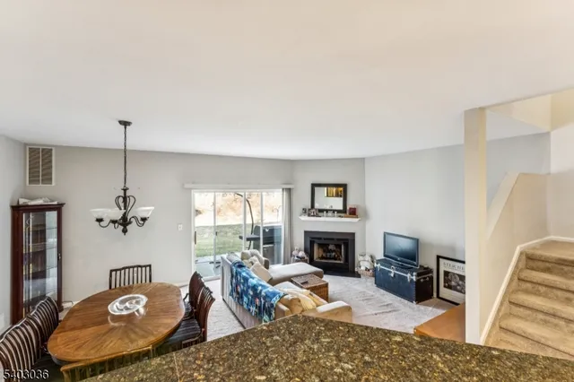 a living room with furniture fireplace and a flat screen tv