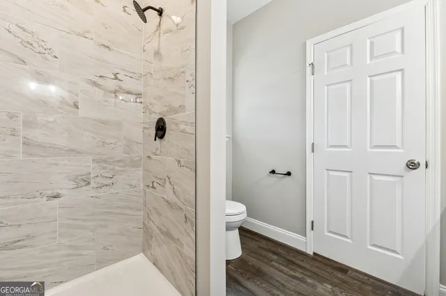 a bathroom with a granite countertop shower