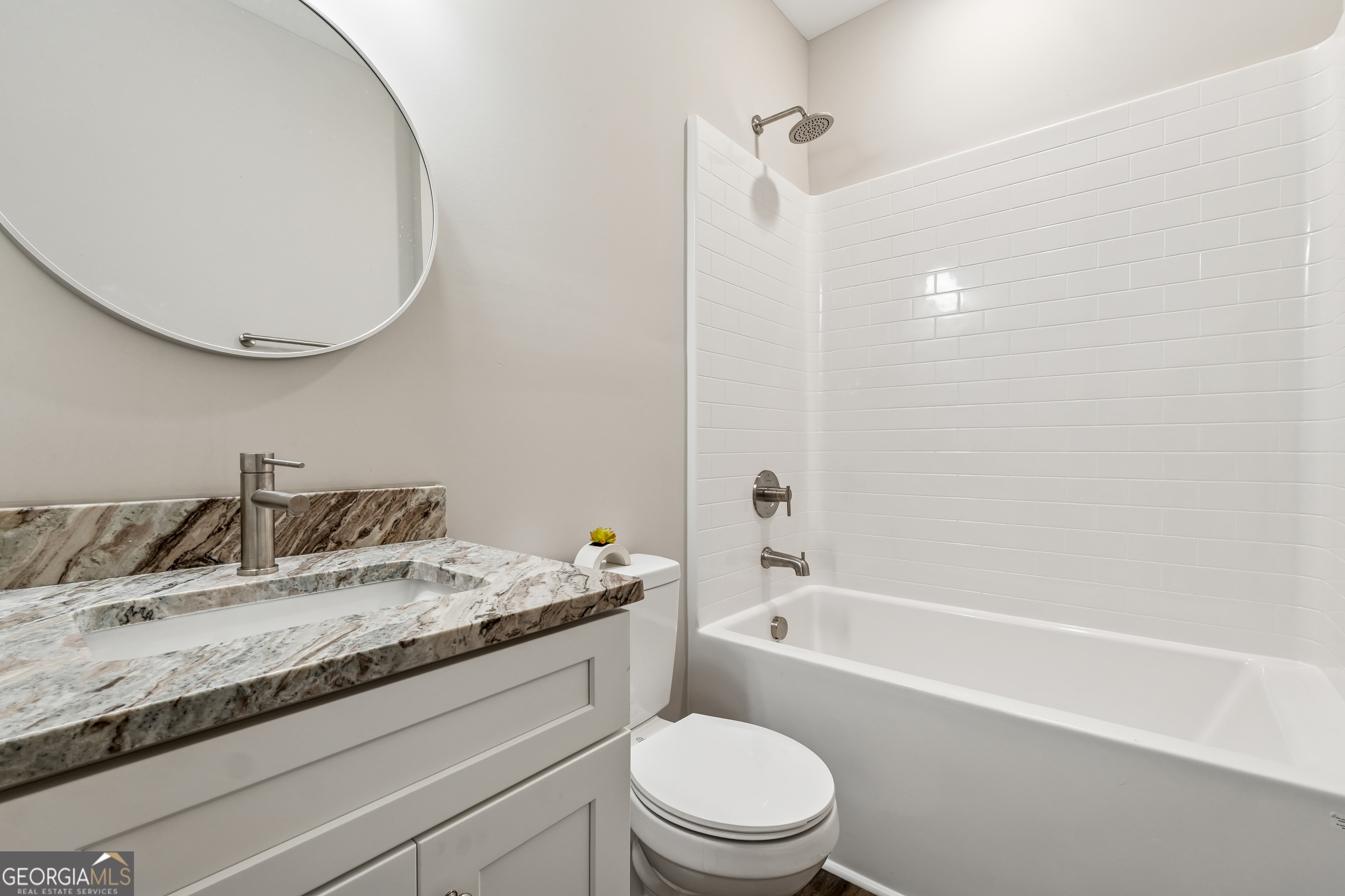 111 Hosea Street Rome, GA 30161 - Photo 14 of 14 a bathroom with a granite countertop sink a toilet and bathtub
