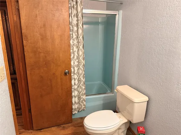 a view of front door with wooden floor