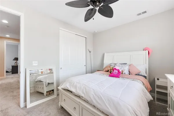 a bedroom with a bed and painted wall