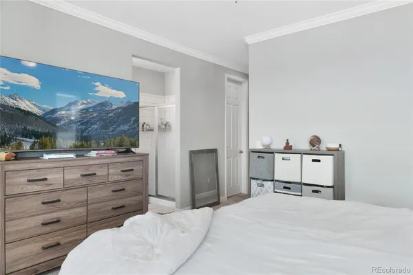 a bed room with a bed and a mirror