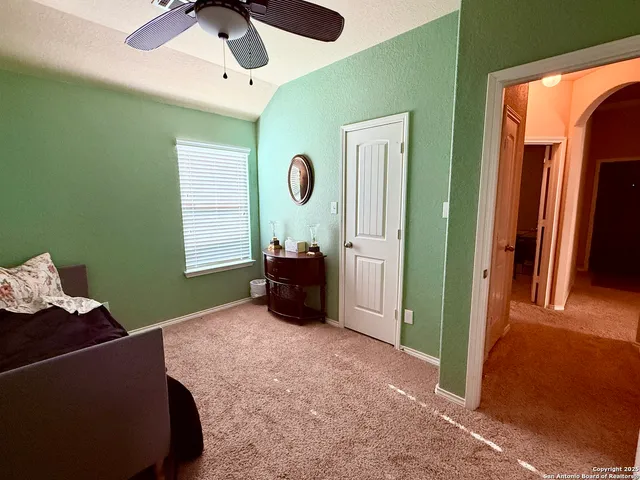 a bed room with furniture and a window