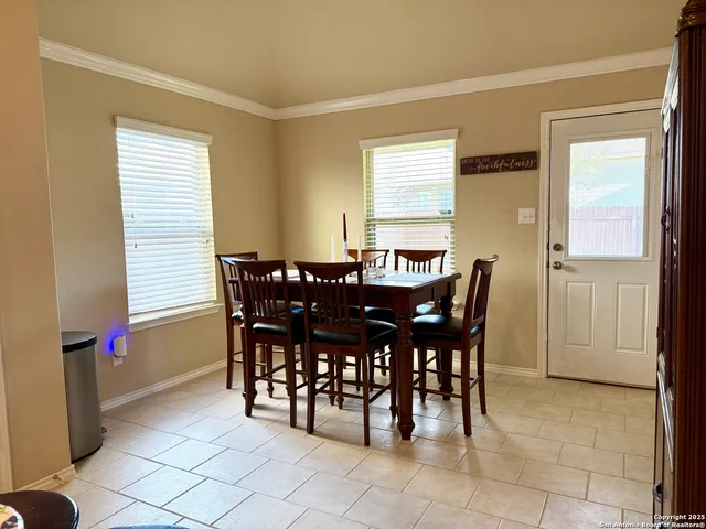 a view of a dining room with furniture