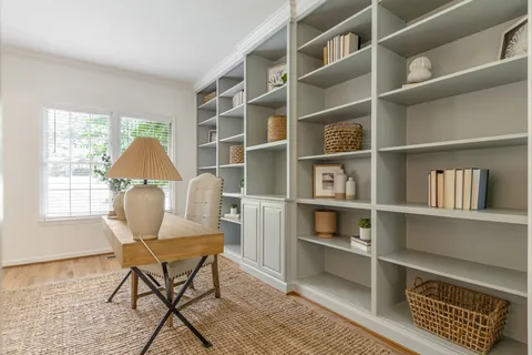 a view of a livingroom with furniture and staircase