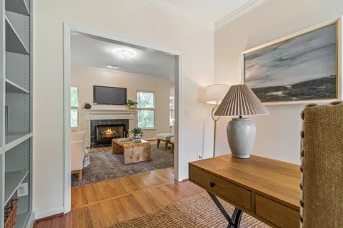 a dining room with furniture and window