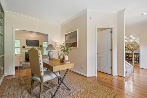 a dining room with furniture and window