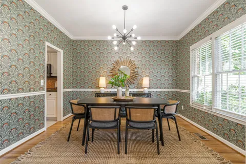 a kitchen with stainless steel appliances a sink a stove and a refrigerator
