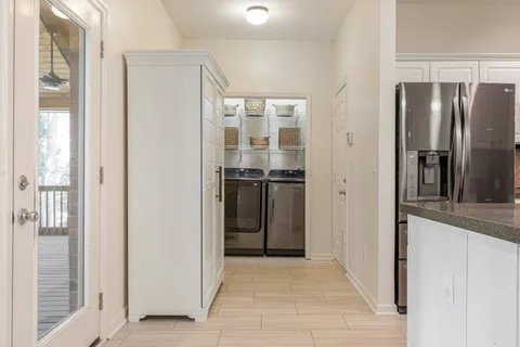 a kitchen with stainless steel appliances granite countertop a sink and cabinets