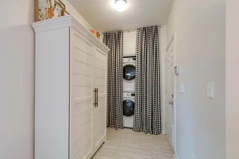 a kitchen with stainless steel appliances granite countertop a refrigerator a stove and a sink with wooden floor