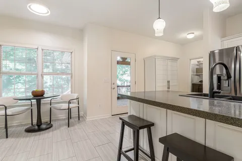a view of a livingroom with furniture and a window
