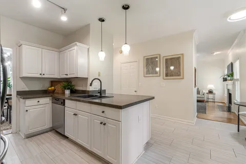 a living room with furniture and a ceiling fan