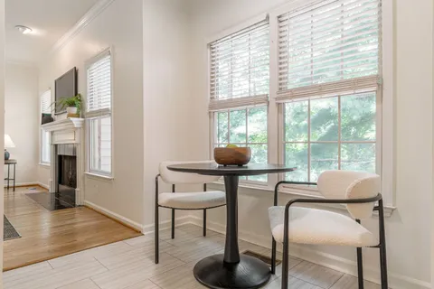 an empty room with closet and a ceiling fan