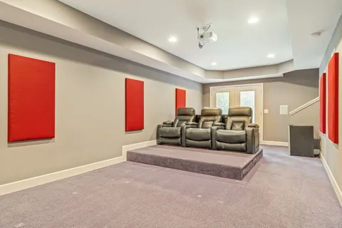 a bathroom with a granite countertop sink a toilet and shower