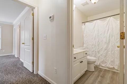 a view of balcony with wooden floor and fence