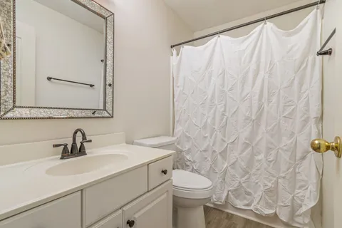 a view of balcony with wooden floor and fence