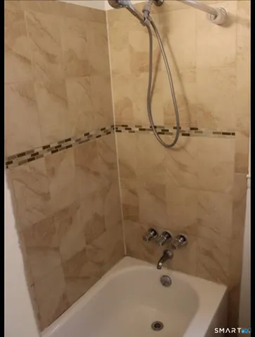 a bathroom with a sink and a shower