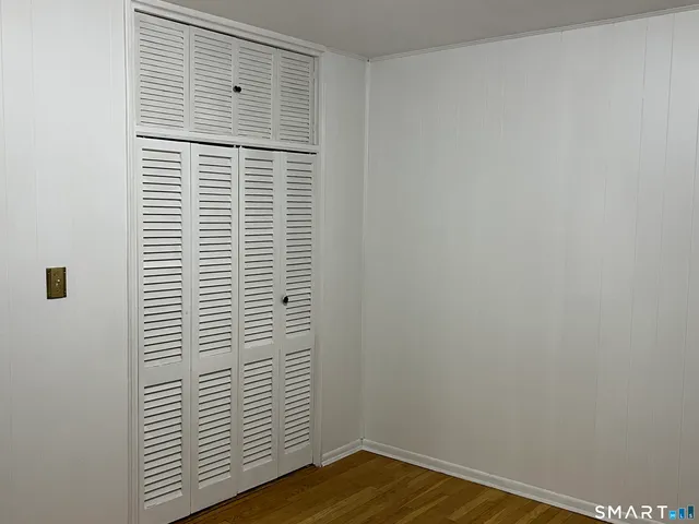 a view of a small space with wooden floor