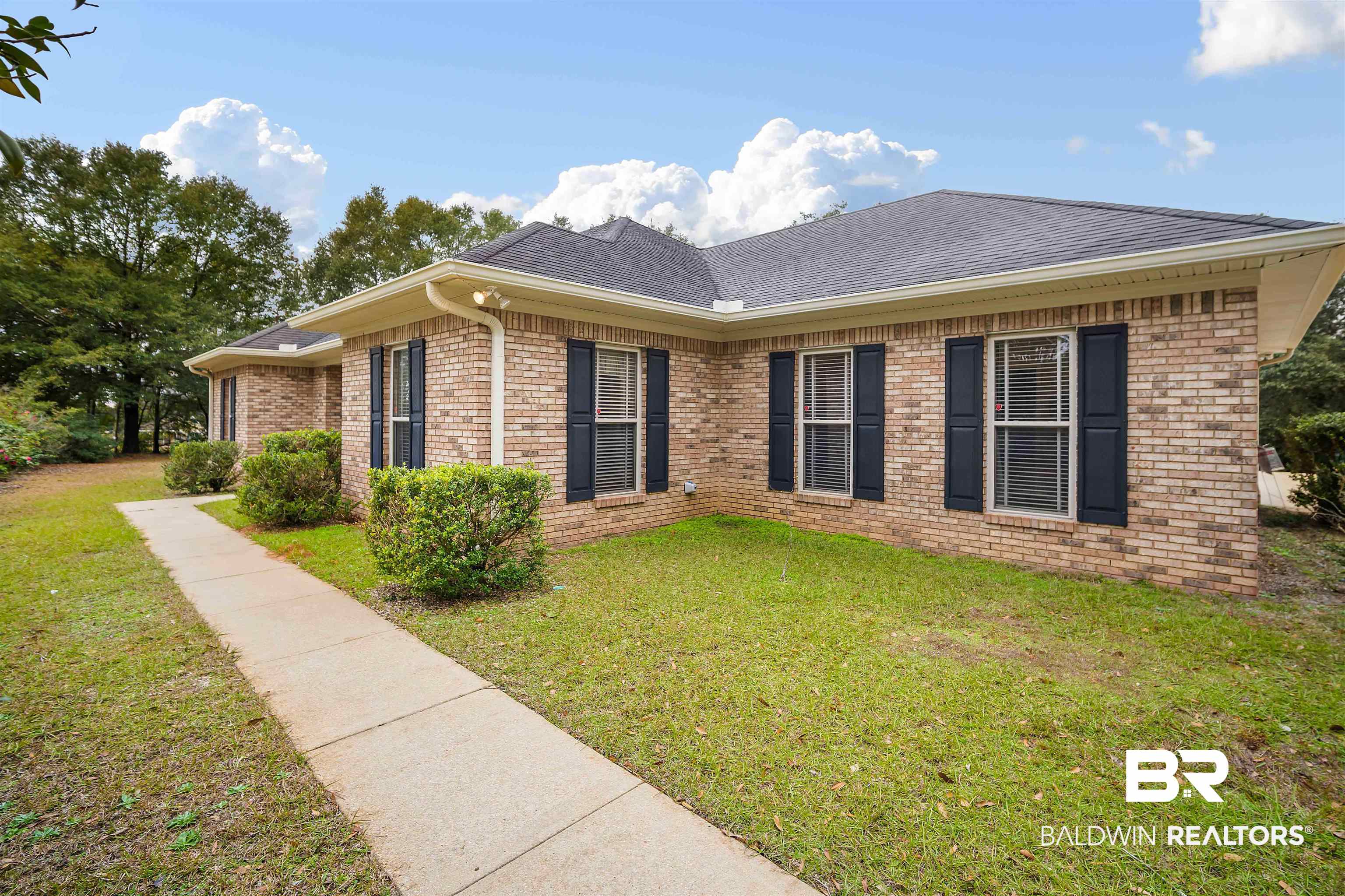 7419 Pake Road Saraland, AL 36571 - Photo 3 of 27 Exterior space featuring a front lawn