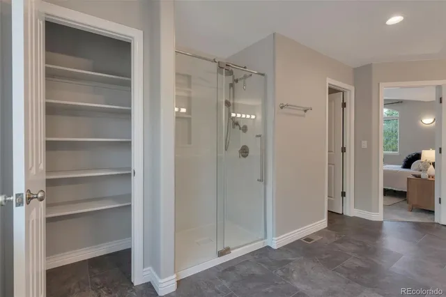 a view of a bathroom with a glass door shower