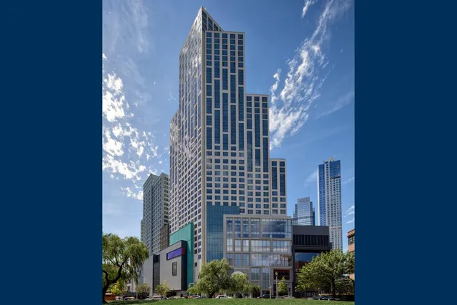 front view of a brick house with a small yard