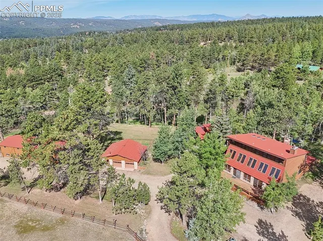 an aerial view of a yard with an outdoor space
