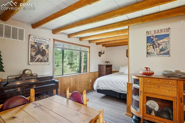 a bedroom with two beds and a window